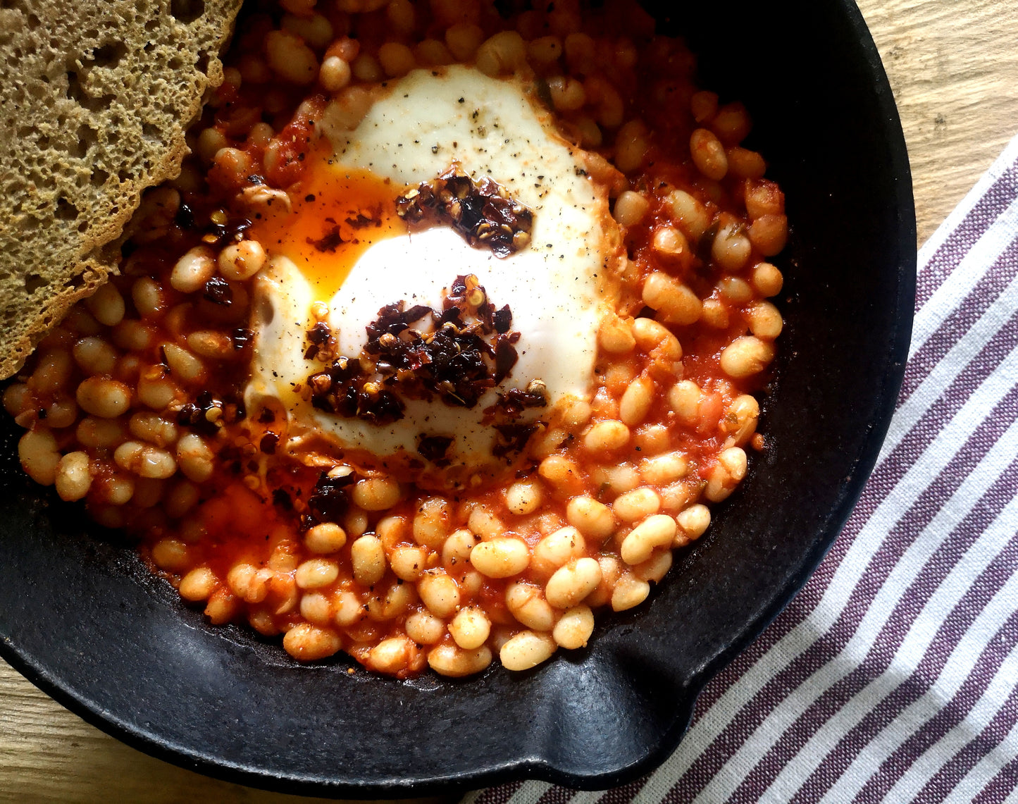 humble beans and sourdough toast elevated with Čili Mafija's Česnako Bomba crispy chilli oil with extra garlic goodness